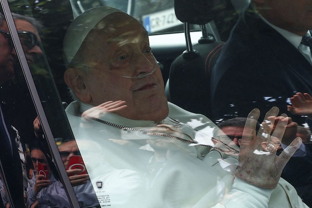 Pope Francis waves as he leaves Gemelli Hospital, in Rome, Italy, on Sunday, March 23. Photo by Guglielmo Mangiapane/Reuters