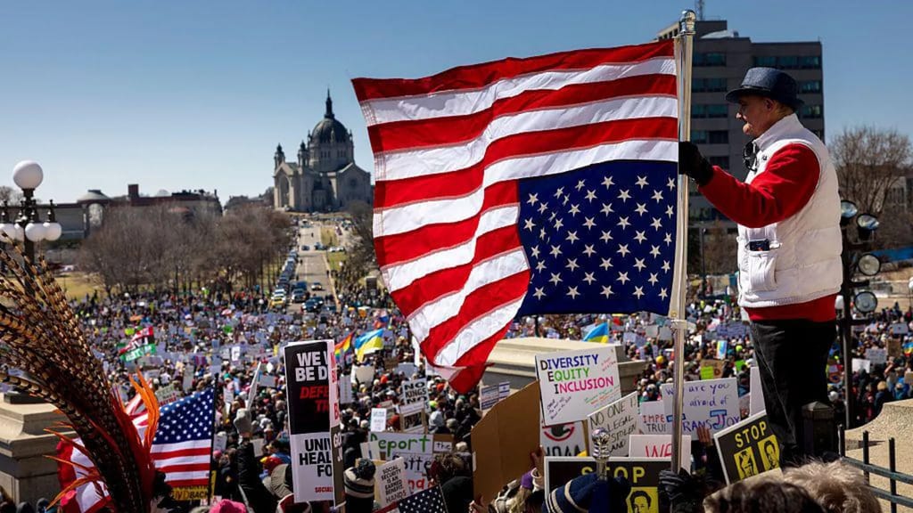 In St. Paul, Minnesota, protesters railed against Trump and flew an upside down American flag, a distress message that has become a symbol of protest.