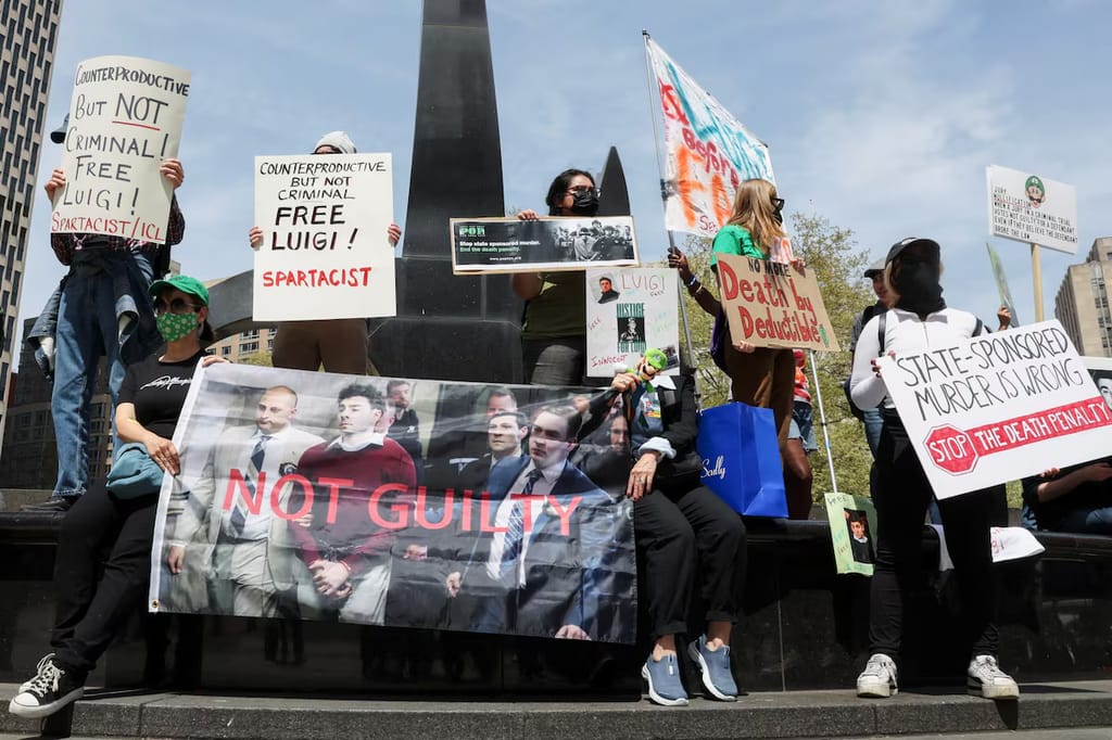 Supporters of Luigi Mangione gather across the street from the United States Courthouse in Manhattan, where Mangione is scheduled to be arraigned on a federal indictment on charges of murdering UnitedHealthcare CEO Brian Thompson in 2024, in New York.