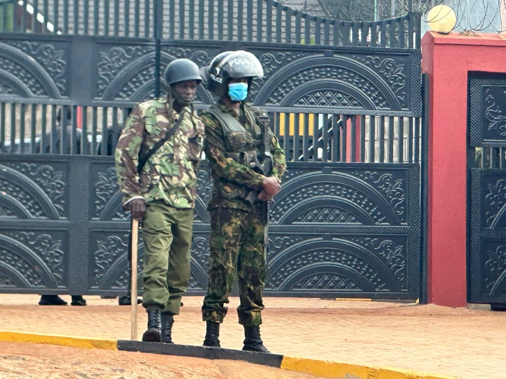 Armed police stay guard outside Natembeya’s home.