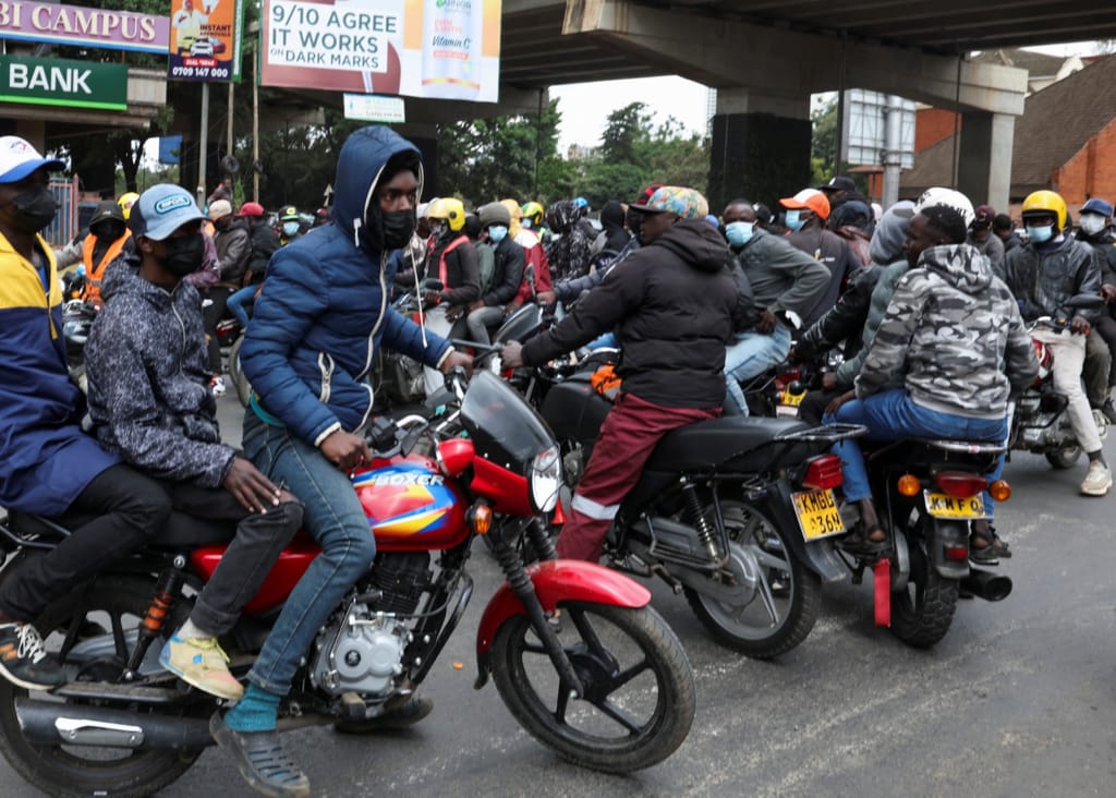 Goons in mortorbikes roam the city as protesters march.