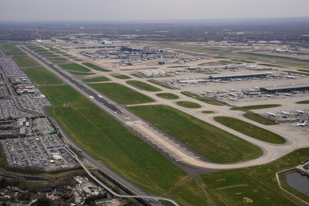 An aerial photograph taken on March 21, 2025 shows planes parked on the tarmac of Heathrow Airport, which has submitted a $49 billion to expand the site and build a third runway (STR)STR/AFP/AFP