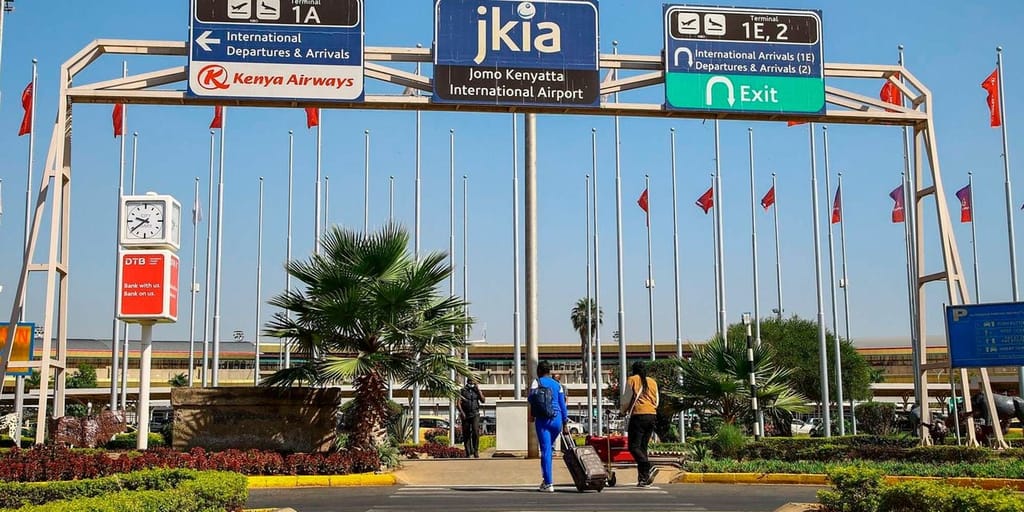 Travelers at Jomo Kenyatta International Airport in Nairobi.