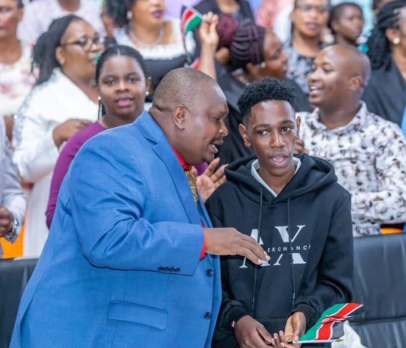 Jesus Compassion Ministries Church’s Bishop Benson Gathungu Kamau conversing with Kaluma Boy during the thanksgiving service.